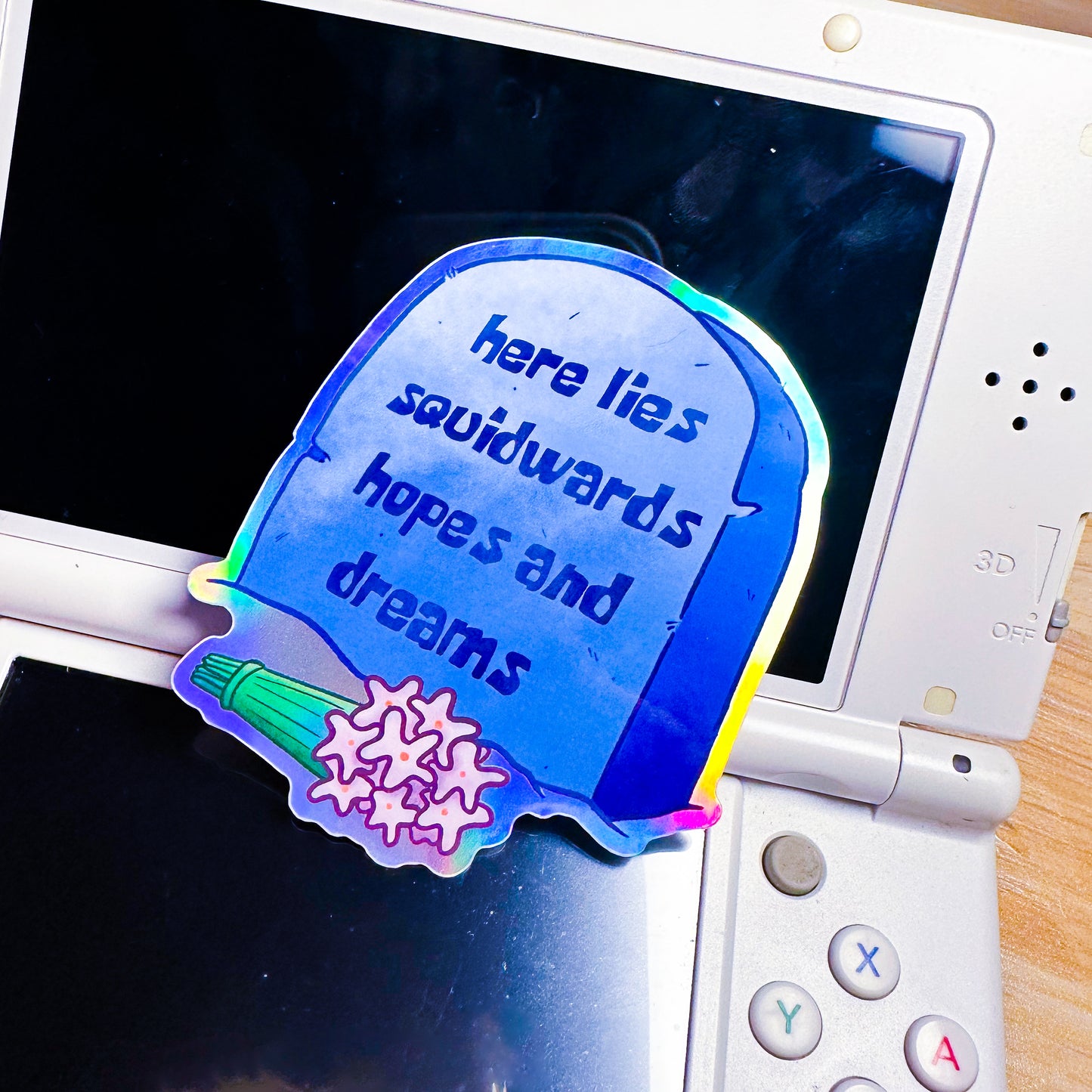 here lies squidwards hopes and dreams holographic sticker